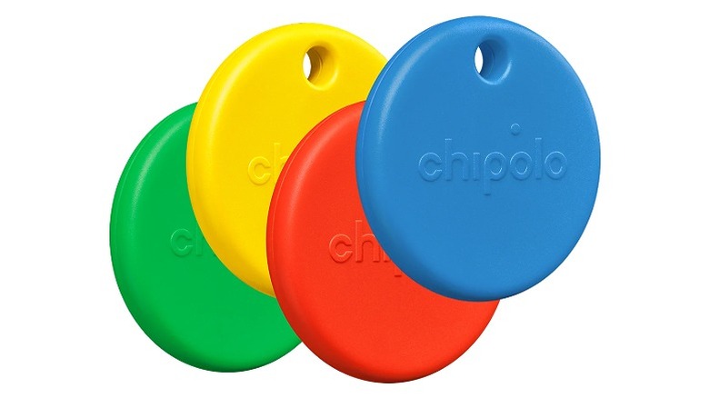 Four colorful Chipolo item trackers in green, yellow, red, and blue.