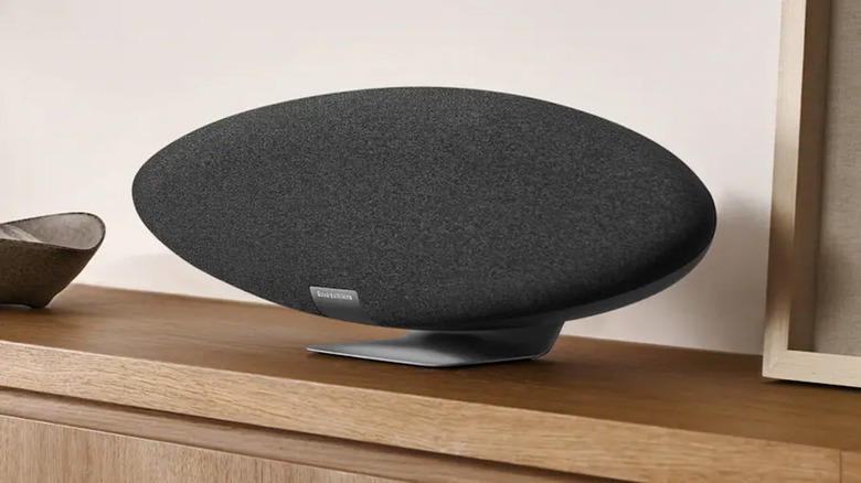 A Bowers & Wilkins Zeppelin Pro speaker on a minimalist wooden table