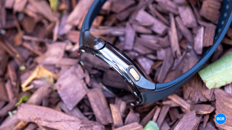 Close-up side view of the OnePlus Watch 3 showing the rotating digital crown and secondary button.