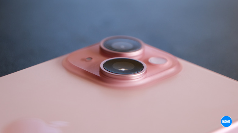 Detailed view of the iPhone 15 dual-camera module on the back of the phone.
