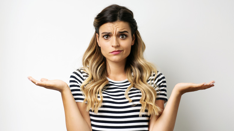 A blonde woman looking puzzled and confused.