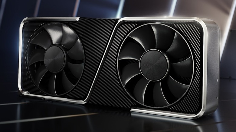 A retail display of an Nvidia 3060 GPU showing the fan design and brand logo.