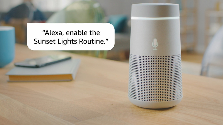 A smart speaker on a surface being used to manage a Sunset Lights routine.