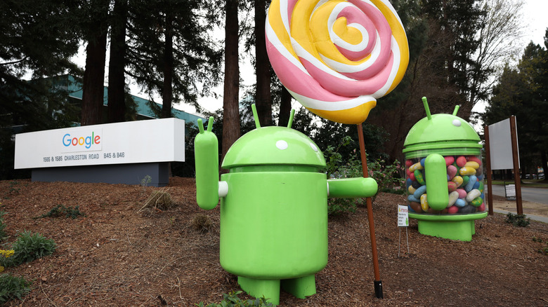 The iconic green Android mascot statues displayed outside Google headquarters.