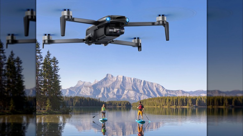 An aerial top-down shot of two paddleboarders on water captured by the Ruko U11MINI.