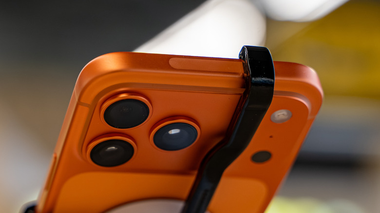Close-up of the iPhone 17 Pro top edge showing the specialized antenna window integrated into the aluminum unibody.