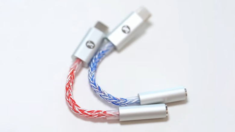Jcally JM6 Pro USB-C dongle DACs in blue and red finishes on a white background.