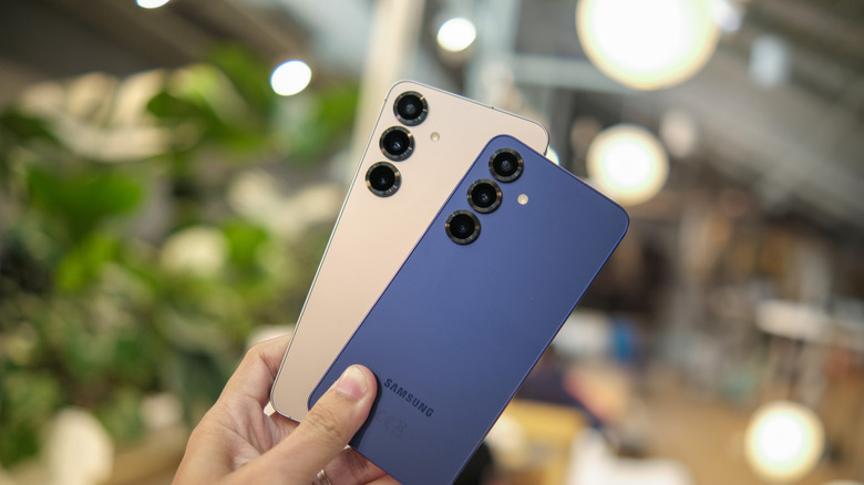 Two hands holding the Galaxy S25 and S25 Plus to show their form factor and screen quality.