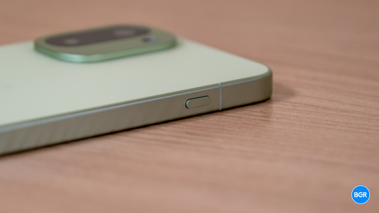 Close-up of the hardware Plus key on the frame of the OnePlus 15R.