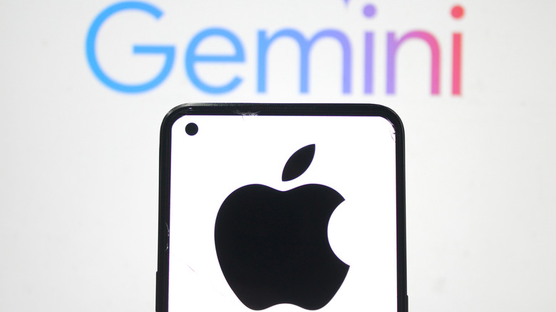 Close-up of an iPhone featuring the Apple logo with a blurred Google Gemini logo in the background.