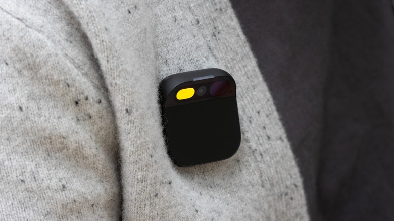 The Humane AI Pin attached to a person's shirt pocket area.
