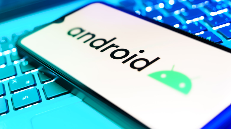 A smartphone screen brightly displaying the green Android logo.