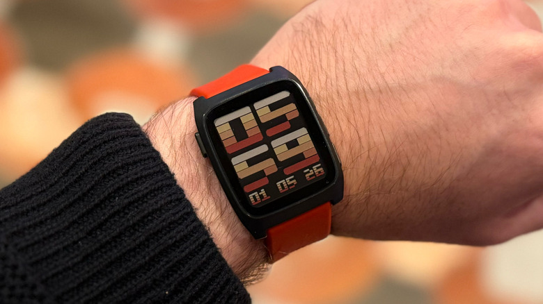 A Pebble Core 2 Duo smartwatch, representing the design heritage of the Pebble brand.