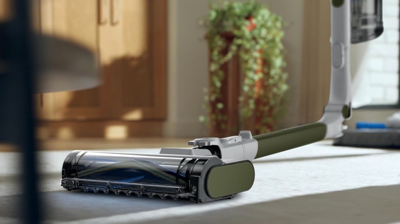 Close-up of the Shark PowerPro Flex vacuum's MultiFlex arm bending to reach under furniture.