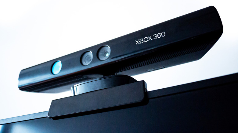 An Xbox 360 Kinect sensor bar mounted on top of a television set.