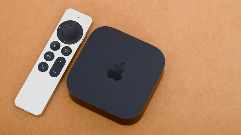 Top-down view of an Apple TV and Siri Remote.