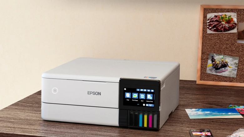 A sleek black Epson EcoTank 8500SE Supertank photo printer on a wooden desk.