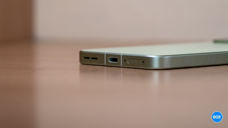 The bottom edge of the OnePlus 15R showing the USB-C port.