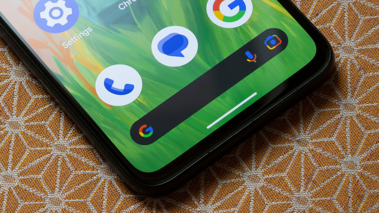 An older Google Pixel 4a smartphone model posed on a table.