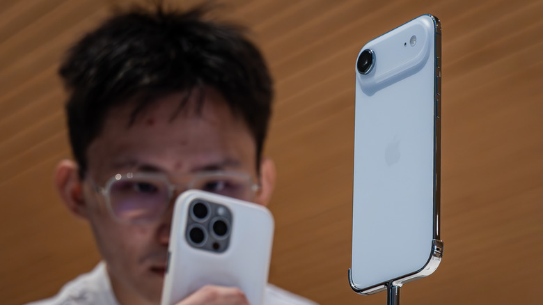 An iPhone Air displayed on a retail stand.