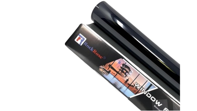 A roll of Rockrose UV protection window tint film designed for car cabin comfort.