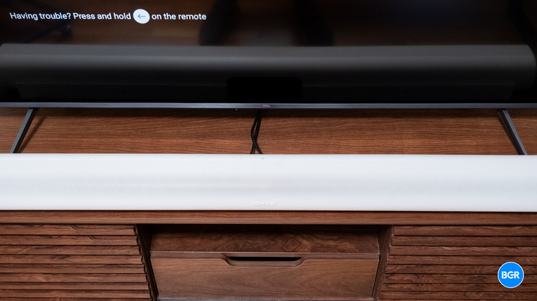 Close-up of the stand feet on the TCL QM6K TV showing the clearance height.