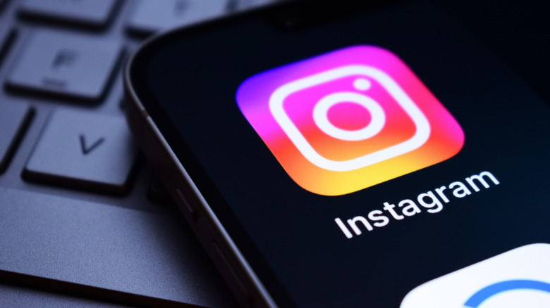 Close-up of the Instagram app icon on a mobile phone home screen.