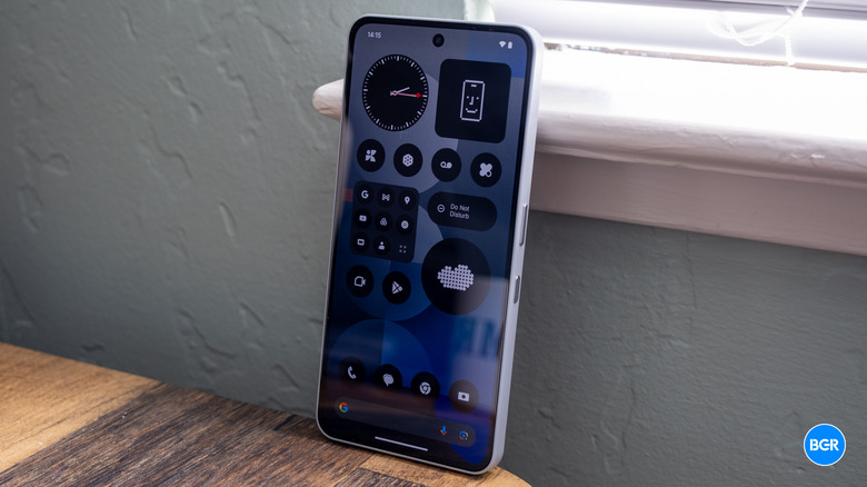 Full front and side view of the Nothing Phone (3a) Pro held in hand.