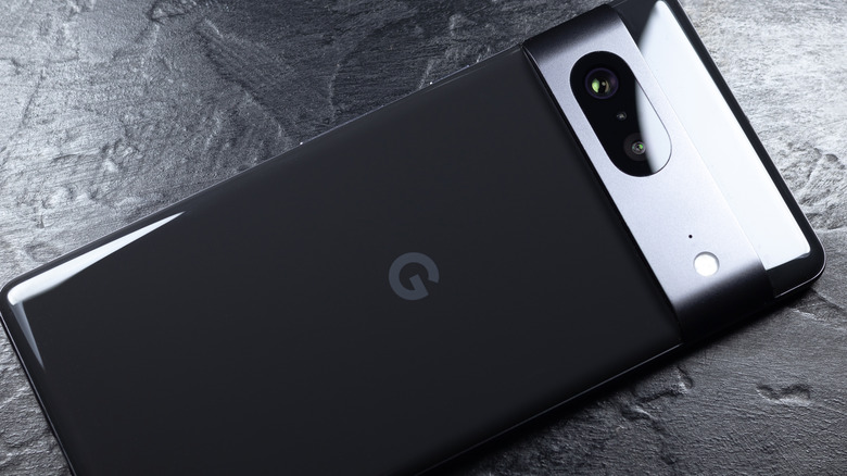 Side profile of a Google Pixel smartphone against a dark, professional background.