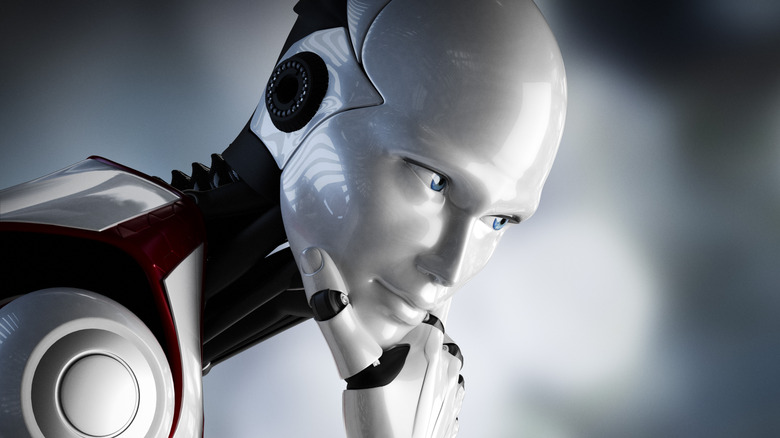 A 3D humanoid robot sitting in a thoughtful, thinking pose.