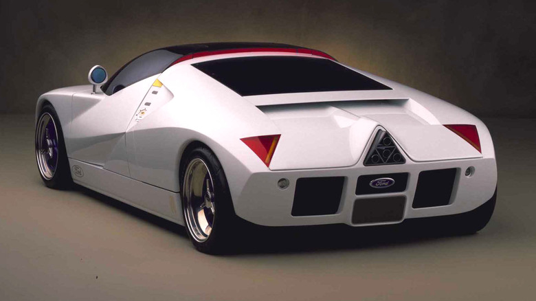 The Ford GT90 concept car in white with its distinctive blue interior and triangular exhaust array.