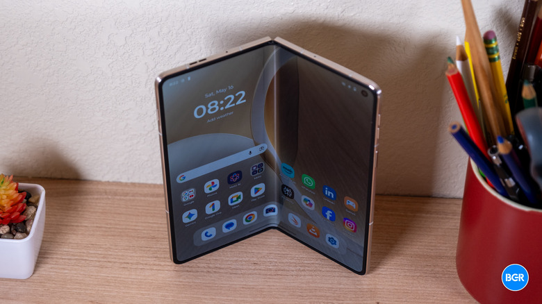 A top-down view of the Motorola Razr Fold showing the thinness of the device and the teardrop hinge structure.