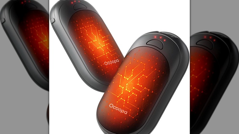 A pair of Ocoopa magnetic hand warmers showing their sleek, curved design.