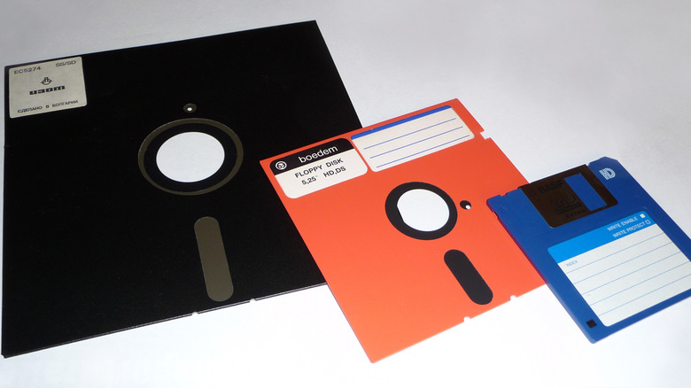 Three different floppy disks in various colors and sizes.