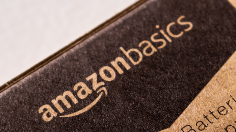 The Amazon Basics logo printed on a brown cardboard shipping box.