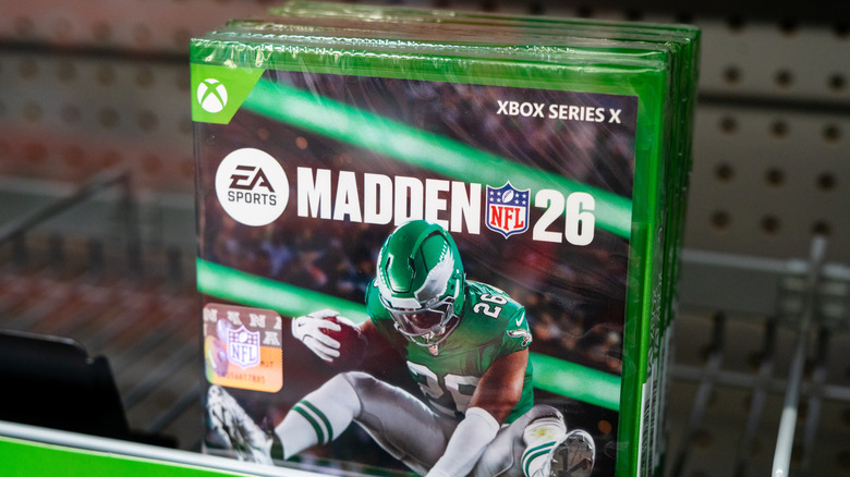 A retail shelf displaying copies of the Madden 26 video game for Xbox.