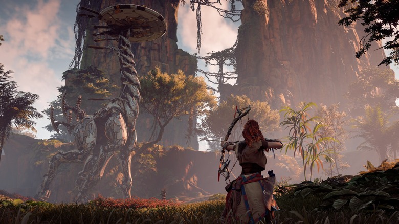 Aloy aiming a bow at a machine in Horizon Zero Dawn Complete Edition