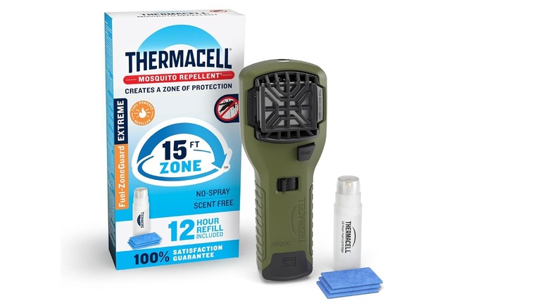 A Thermacell MR300 portable mosquito repeller with its blue heating pad and packaging.