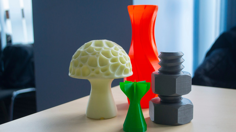 3D-printed art and houseware pieces showcasing modern design aesthetics.