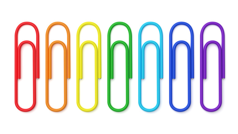 A row of colorful metal paper clips.
