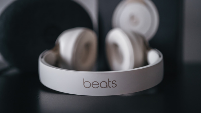A close-up of the Beats logo on the headband of a pair of Solo headphones.