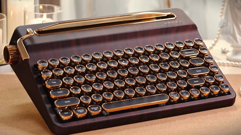 A brown Yunzii QL75 wireless typewriter-style mechanical keyboard with round keys.