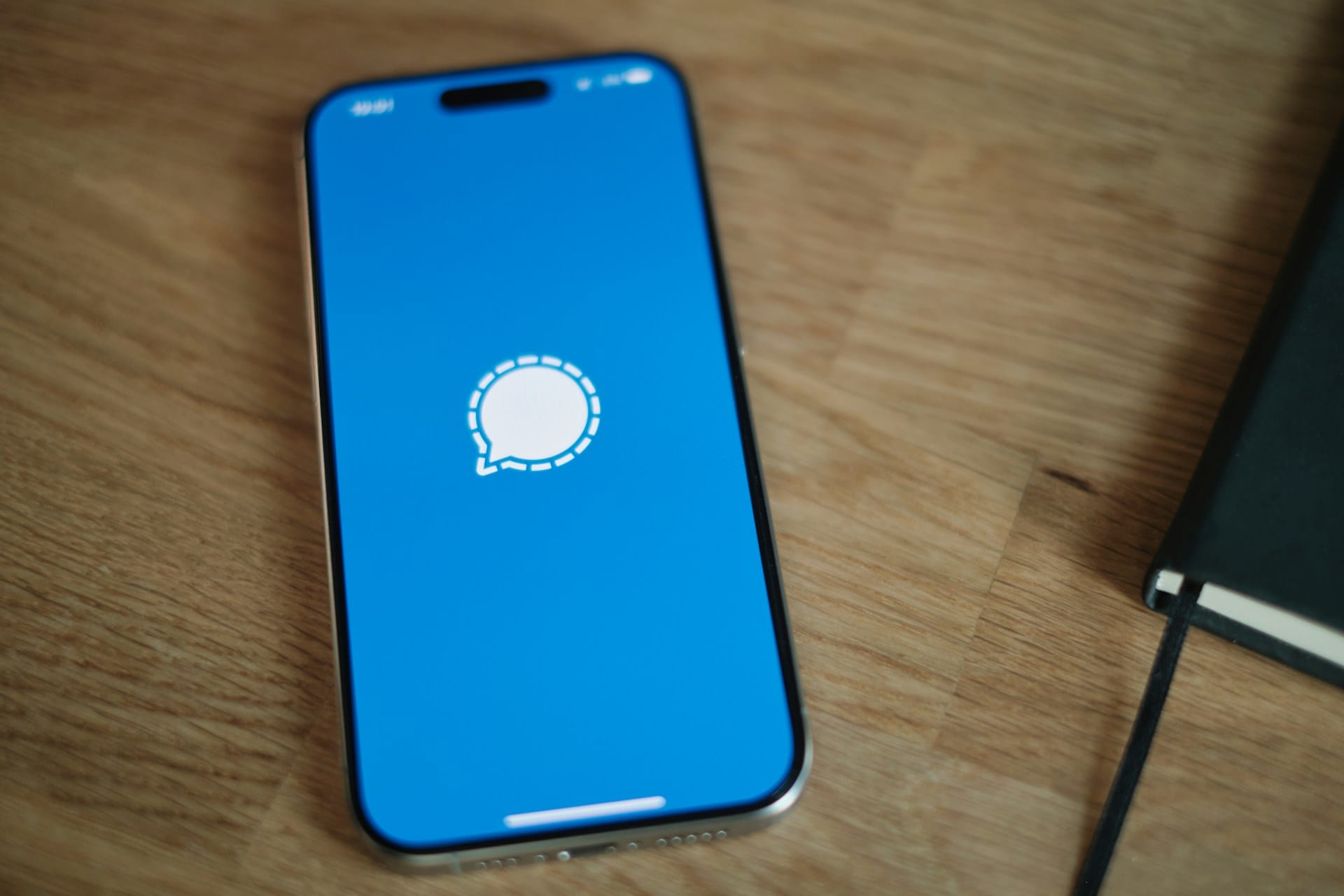 Digital security concept showing encrypted message transmission on a smartphone.
