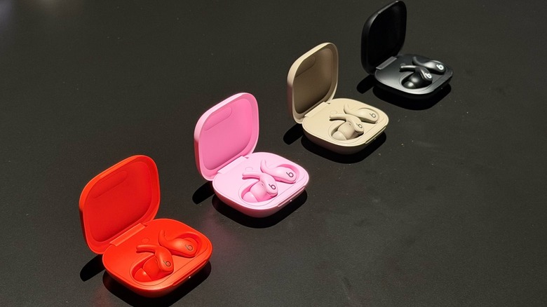 Multiple pairs of Powerbeats Fit earbuds shown in their four available color options.