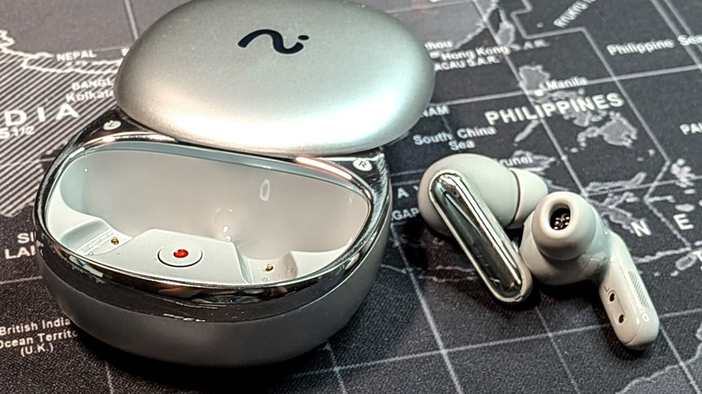 Viaim RecDot earbuds displayed next to their pebble-shaped charging case.