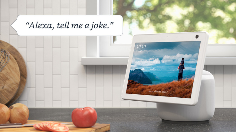 An Amazon Echo device in a bright, sunlit kitchen environment.