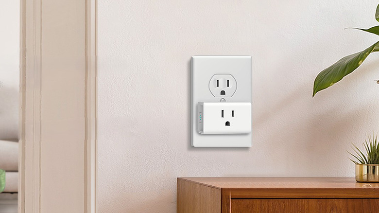 A Kasa Smart Plug Ultra Mini plugged into a standard wall outlet.