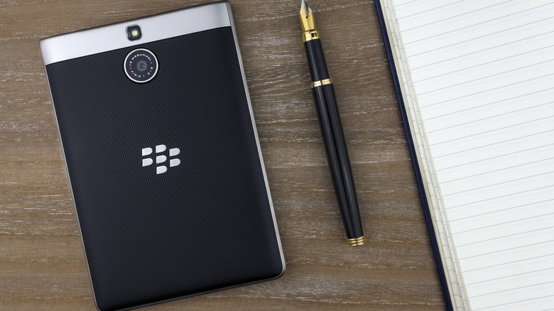 Close-up of a BlackBerry Passport lying face down, showcasing its wide body and physical keyboard.