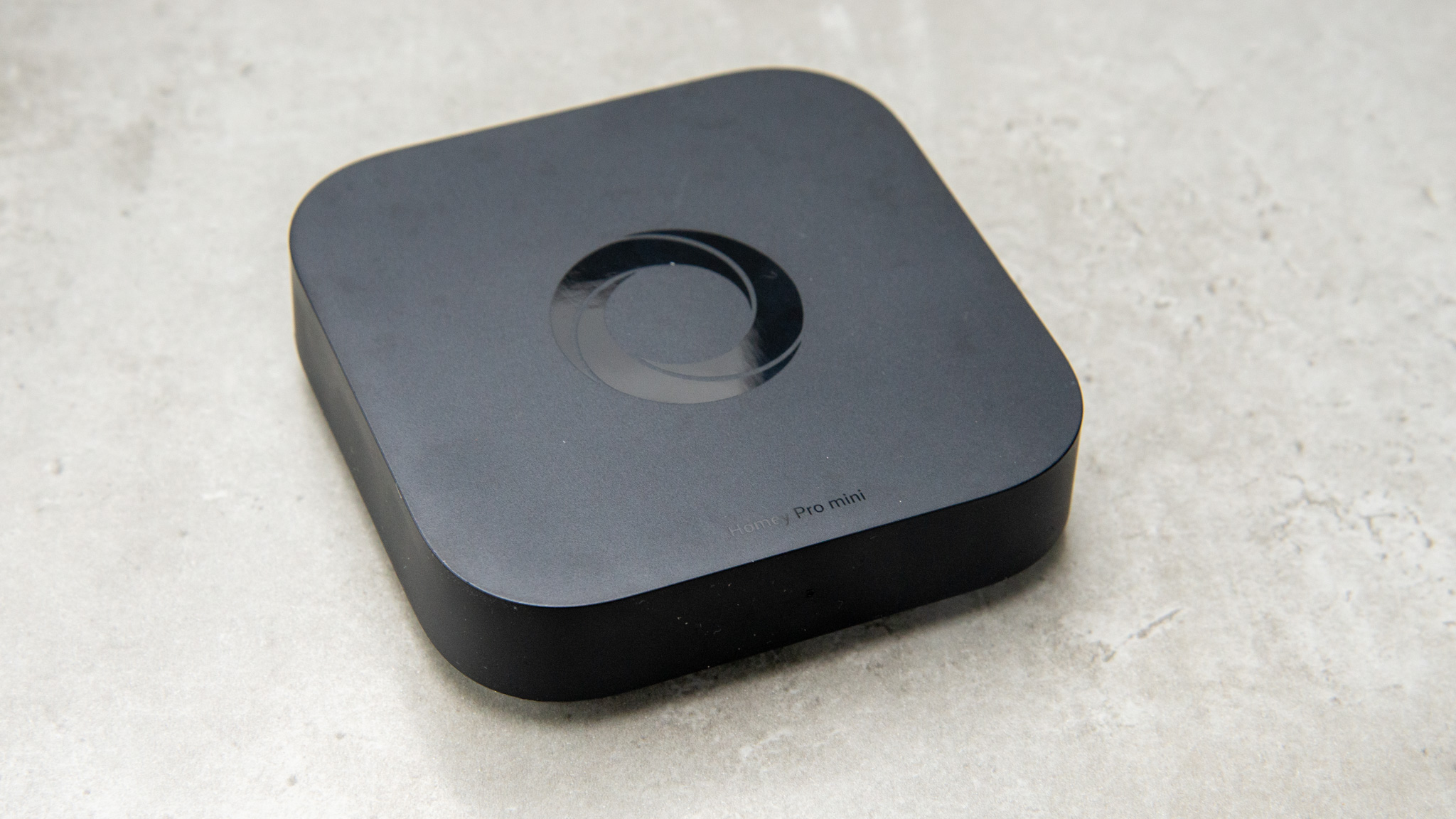 A close-up shot of the Homey Pro 2026 hardware showing its sleek design and LED ring.