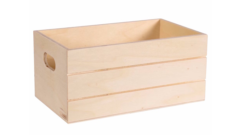 Side-view of a simple unfinished Dollar Tree wooden crate on a neutral background.